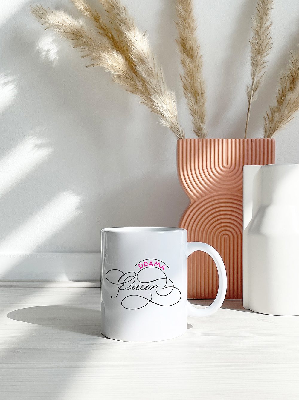 Drama Queen Lettering for decor, accessories or cards.  Design is available as a vector image.  Available art for art licensing

coffee cup with drama queen calligraphy

spot calligraphy